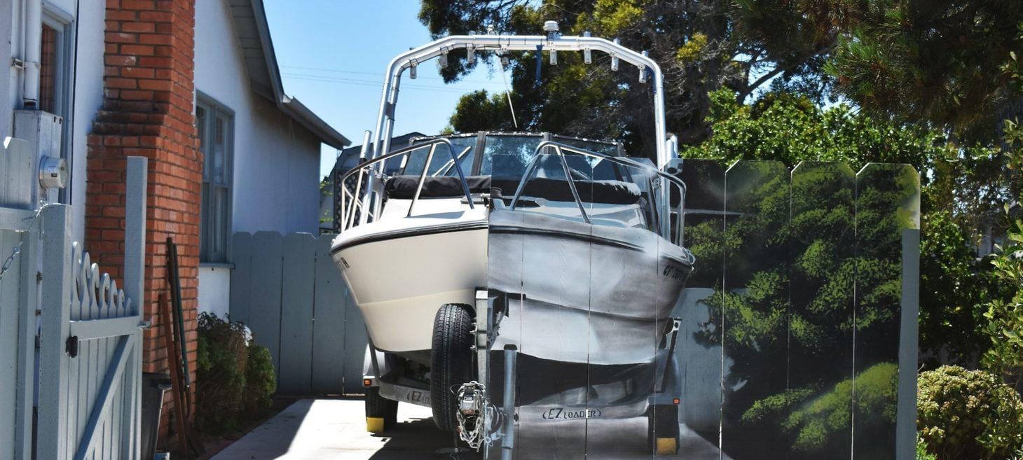 A Man Ordered to Hide His Boat Painted the Boat on His Fence